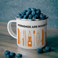 Orange Kayak Enamel Coffee Mug - "Mornings are rough, but kayaking makes it easy" in bold black font